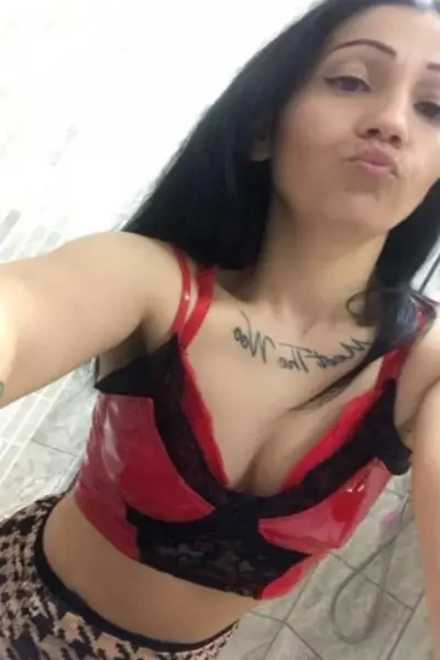 Pouting dark haired escort