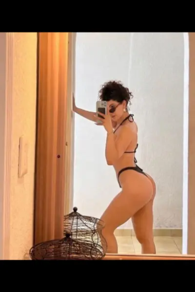 Sutton escort taking a selfie by a mirror