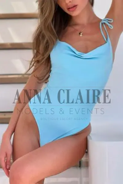 London escort in a light blue swimsuit