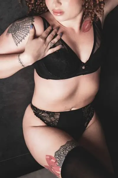 Polish tattooed escort in black lingerie