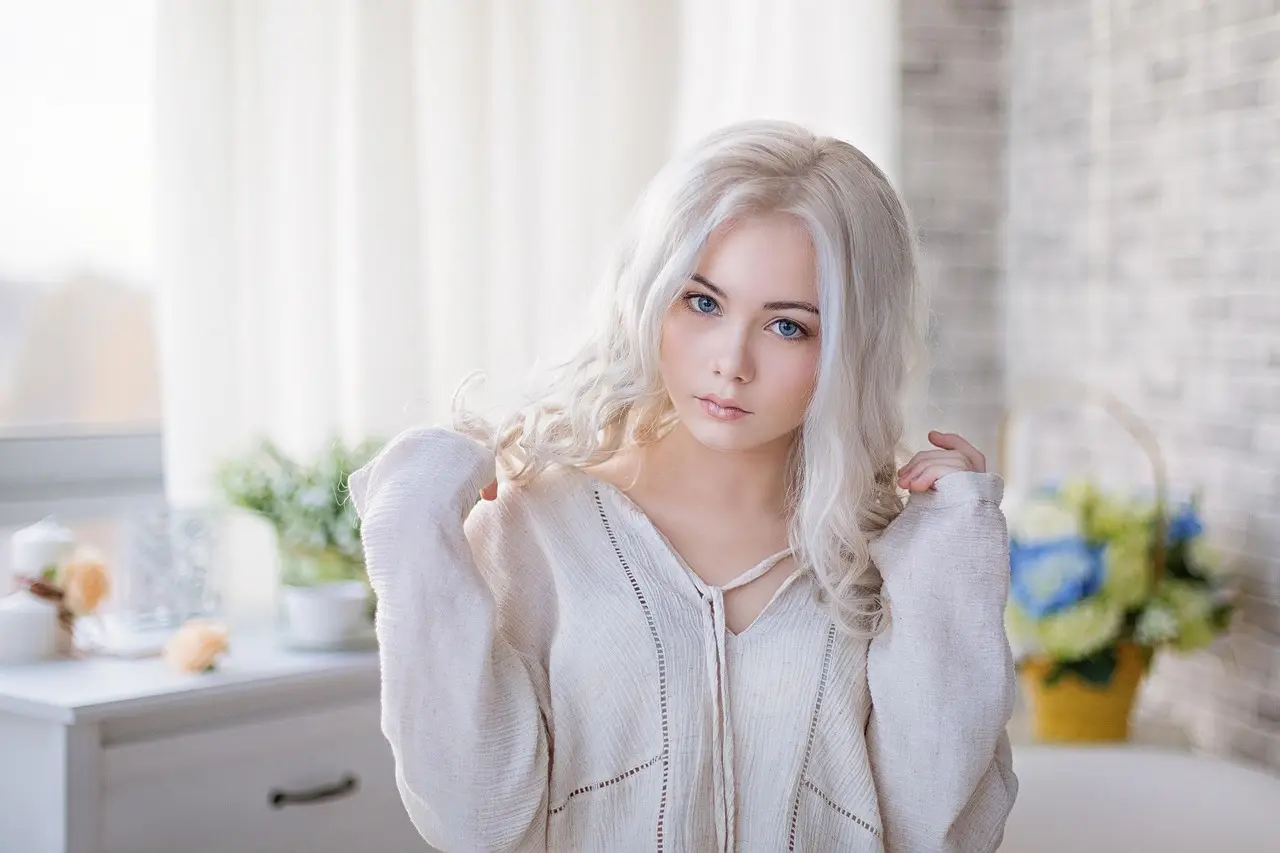 Young blonde girl in her kitchen