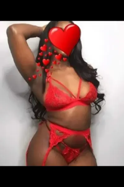 Ebony escort in red lingerie