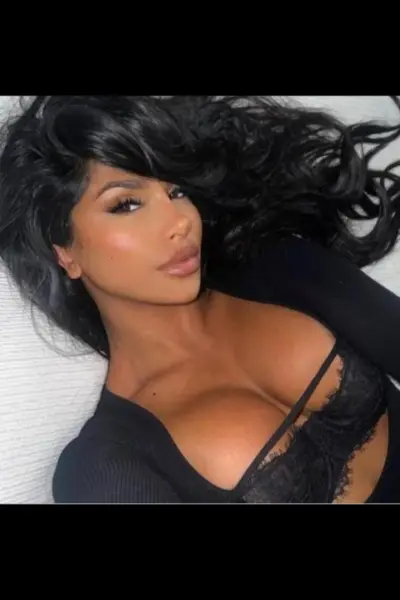 Sexy pert breasted raven haired escort