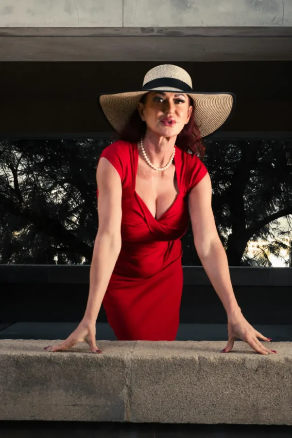 Mature busty Kilkenny escort in a red dress