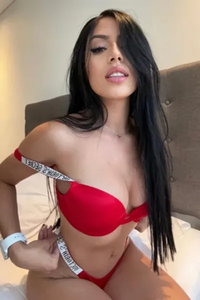 Brunette escort in red bikini