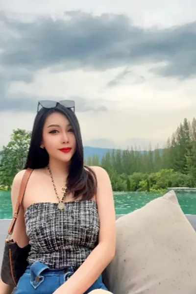 Camberley Escort sat by a river