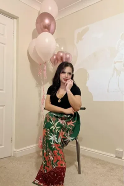 Ladyboy Jasmine TS sat in front of balloons