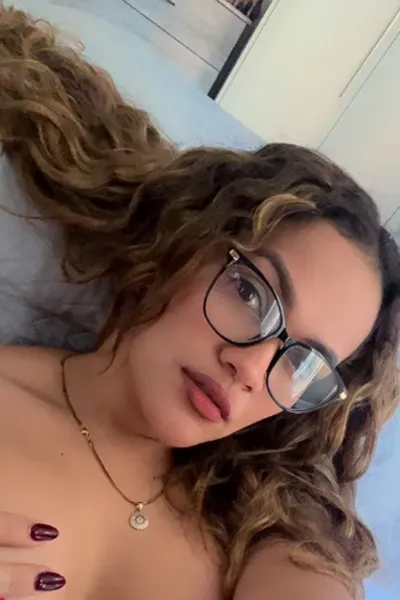 Latina escort wearing glasses