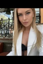 Classy blonde Edinburgh escort in a white blazer