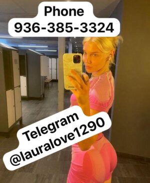 Blonde escort taking a selfie in the gym