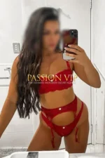 Romanian Escort in red lingerie taking a selfie