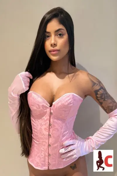 Rathgar Escort in a pink corset and gloves