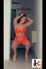 Brunette Dublin escort in orange lingerie