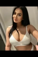 Busty Romanian escort in white lingerie
