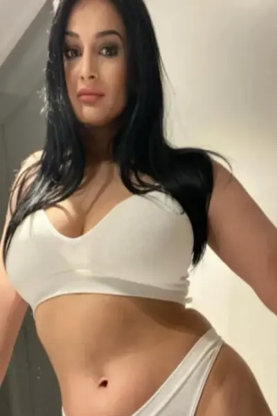 Busty Romanian escort in white lingerie