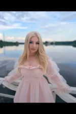 Blonde Plymouth Escort in a light pink dress