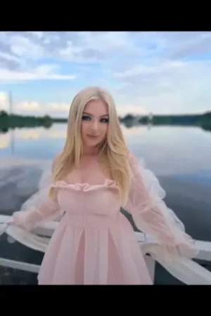 Blonde Plymouth Escort in a light pink dress