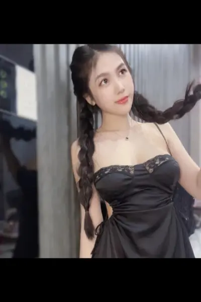 Nuru Massage escort in a silky black dress