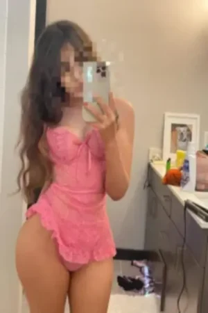 Ladyevee wearing a pink corset